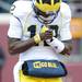 Michigan quarterback Devin Gardner takes a moment as he leaves the field after throwing a touchdown in the third quarter against Minnesota at TCF Bank Stadium in Minneapolis, Minn. on Saturday. Melanie Maxwell I AnnArbor.com